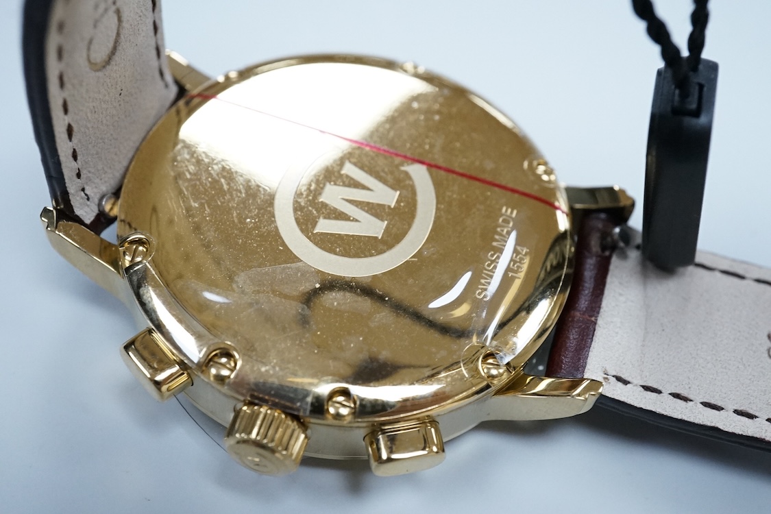 A boxed modern Christopher Ward of London gilt stainless steel chronograph quartz wrist watch, case diameter 40mm, on a Christopher Ward leather strap with deployment clasp, with papers but not for this model.